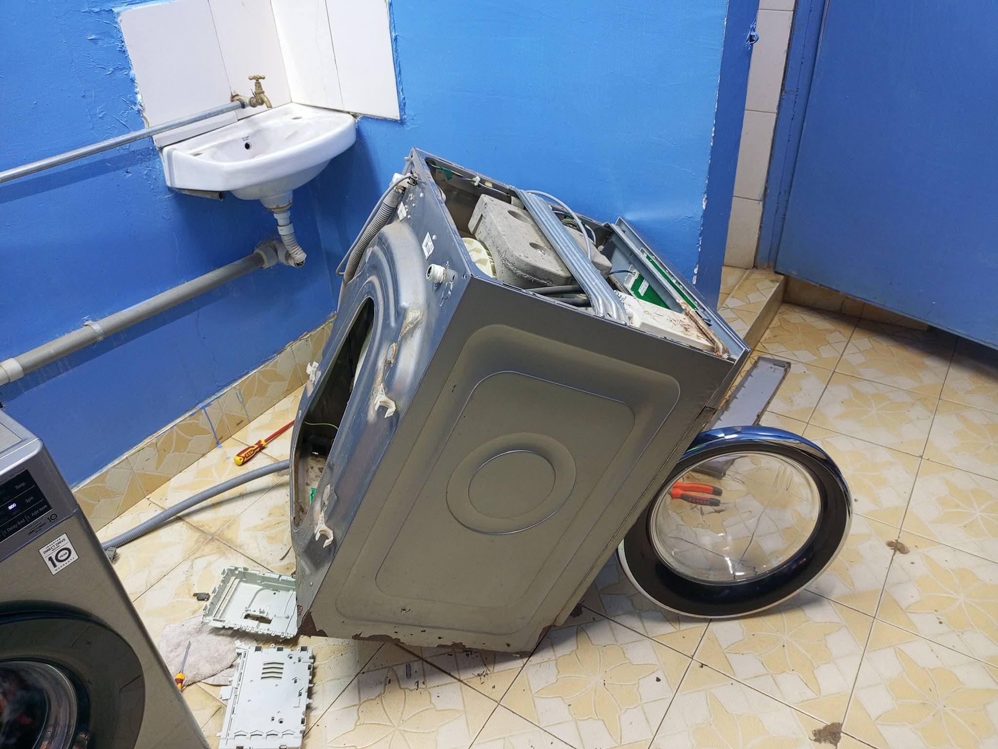 Applicare technician repairing a home appliance